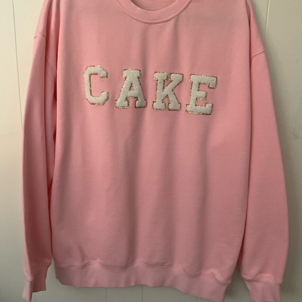 Pink Sweatshirt with CAKE embellishment